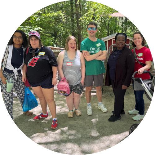 Six members of the community stand together outdoors Six members of the community stand together outdoors